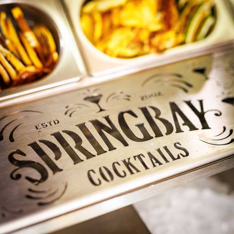 Close-up of the engraved Springbay Cocktails logo in the stainless steel