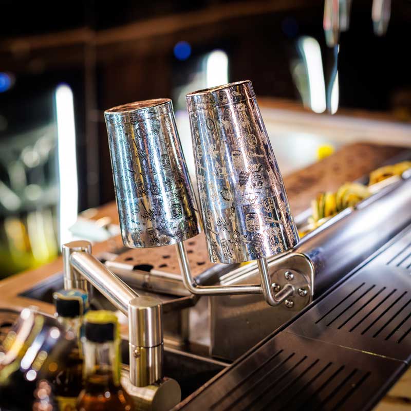 Glassware within reach above the work surface of the installed station