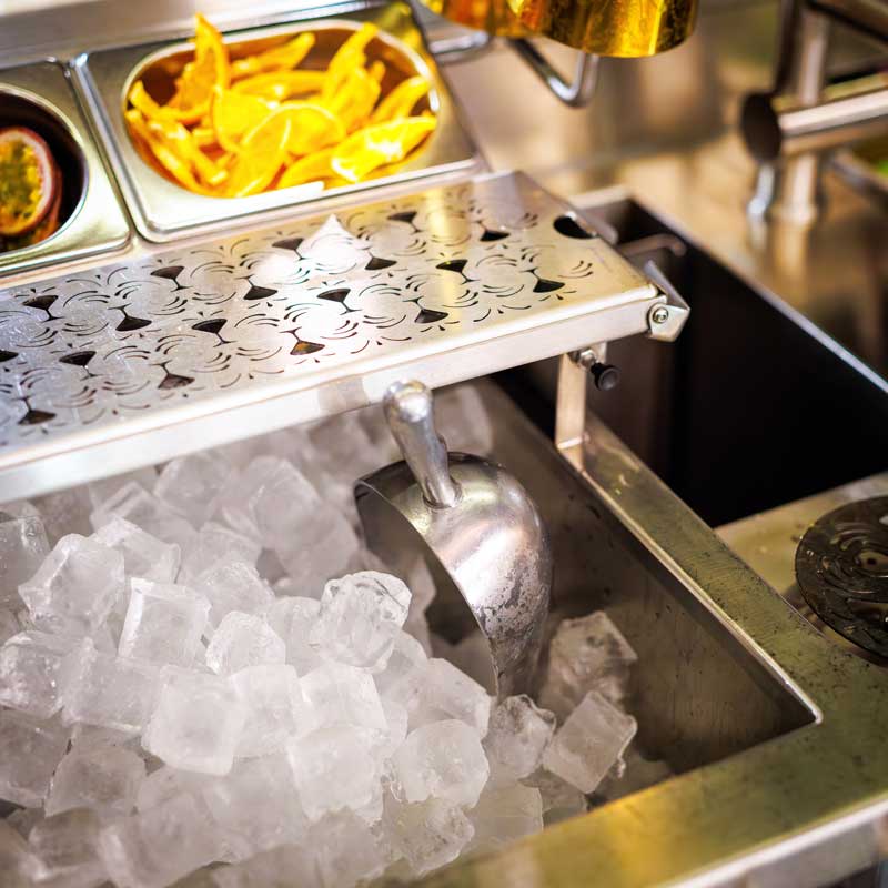 Crushed ice and scoop in the station's chilled ice well